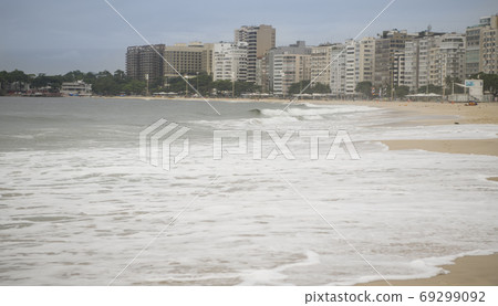 Rio de Janeiro, Brasil- February 28, 2020: Citizens swim and sunbathe on the beach of Copacabana Rio de Janeiro, Brasil- February 28, 2020: Citizens swim and sunbathe on the beach of Copacabana 69299092