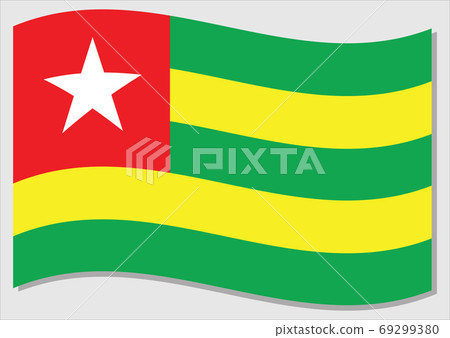 Waving flag of Togo vector graphic. Waving Togolese flag illustration. Togo country flag wavin in the wind is a symbol of freedom and independence. 69299380