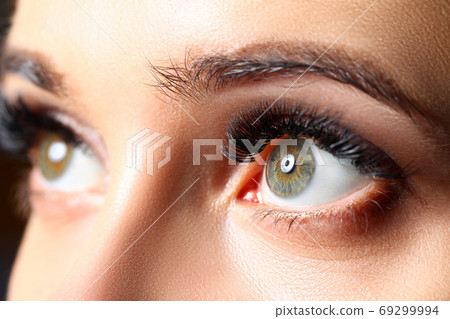 Amazing female green colored eyes with eyelashes extensions 69299994