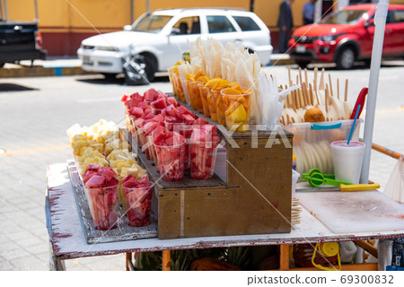 Streets of Cholula, Mexico Street sales of fruits such as watermelon and mango 69300832