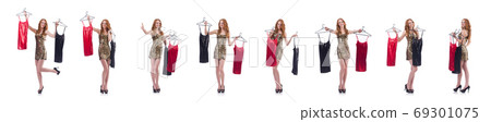 Woman trying new clothing on white Woman trying new clothing on white 69301075