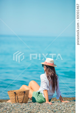 Young beautiful woman having fun on tropical seashore. Young beautiful woman having fun on tropical seashore. 69301467
