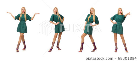 Young woman in green dress isolated on white 69301884