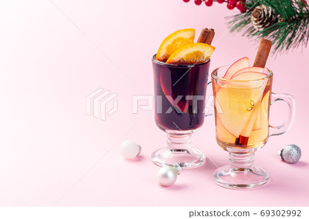 Red and white glogg or mulled wine pink background Red and white glogg or mulled wine pink background 69302992