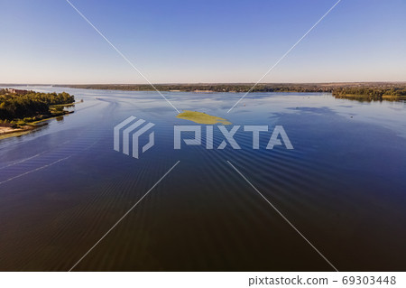 Wide River with boats and traces on the water. 69303448