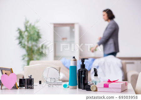 Young handsome man preparing for date Young handsome man preparing for date 69303958