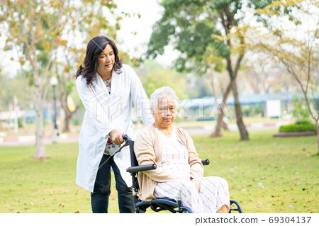 Doctor help and care Asian senior or elderly old lady woman pati 69304137
