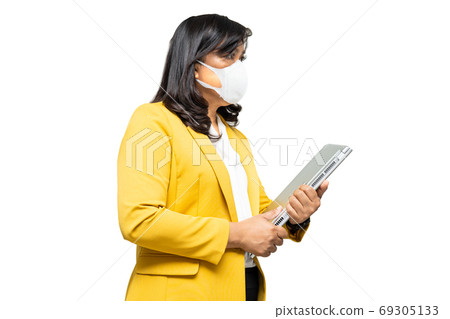 Business asian lady wearing face mask holding laptop isolated on 69305133