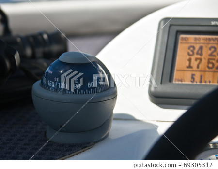 Sea compass on a modern yacht 69305312