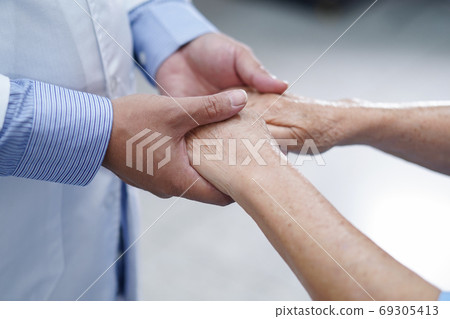 Holding Touching hands Asian senior or elderly old lady woman patient with love Holding Touching hands Asian senior or elderly old lady woman patient with love 69305413