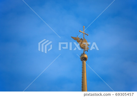The angel on the spire of the Peter and Paul Cathedral in St. Petersburg. The angel on the spire of the Peter and Paul Cathedral in St. Petersburg. 69305457