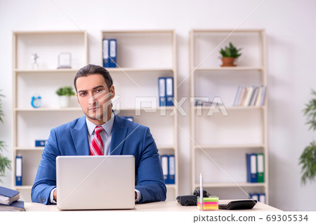 Funny employee clown working in the office 69305534