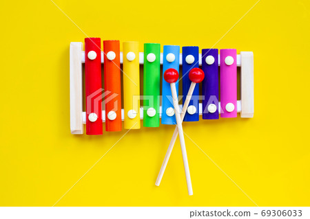 Colorful xylophone on yellow background. 69306033