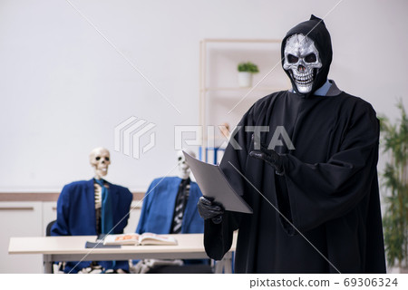 Funny business meeting with devil and skeletons Funny business meeting with devil and skeletons 69306324