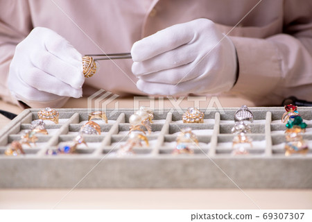 Old male jeweler at workshop Old male jeweler at workshop 69307307