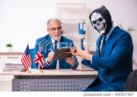 Old businessman employee getting deal with the devil 69307367