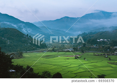 Mountains and green rice fields in the evening Mountains and green rice fields in the evening 69308370