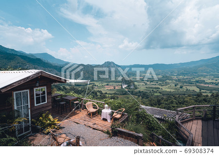 Mountains and green trees during the day Mountains and green trees during the day 69308374