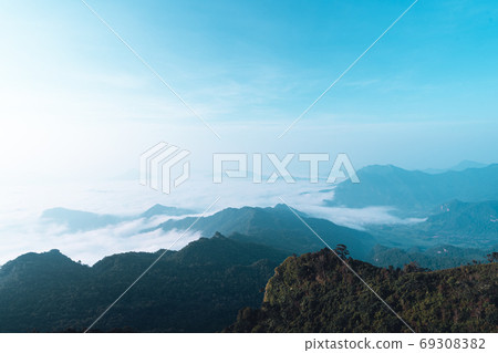 Mountains and fog in the morning on the hill Mountains and fog in the morning on the hill 69308382