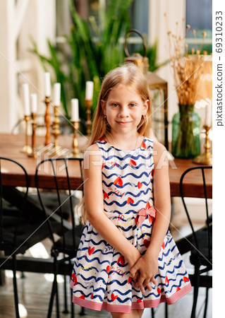 girl with long hair stand in vintage-style room. 69310233