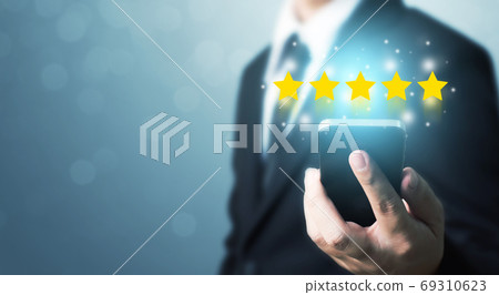 Businessman hand holding smart phone with icon 69310623