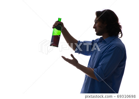 Young man suffering from alcoholism 69310698