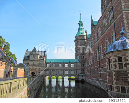 Scandinavian castle with green roof and red brick, Frederiksborg Castle, Hillerod, Denmark 69312551