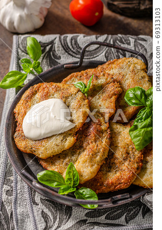 Potato pancakes with garlic and herbs Potato pancakes with garlic and herbs 69313103