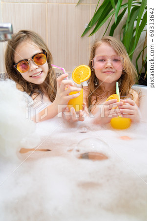 children relax in tub. cannot leave country. children relax in tub. cannot leave country. 69313642