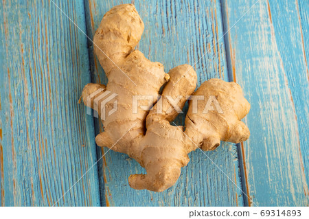 Fresh ginger on white background Fresh ginger on white background 69314893