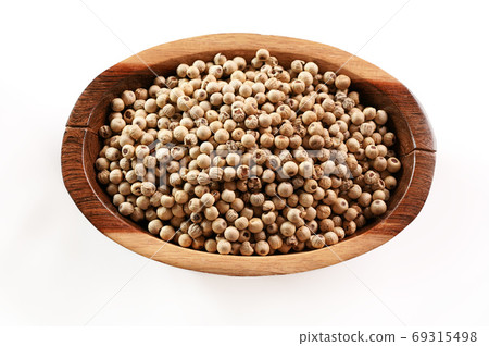 Dried white pepper corns in small wooden bowl - view form above isolated on white background 69315498