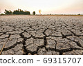 The fields are dry, the land is broken. And the evening sun. 69315707