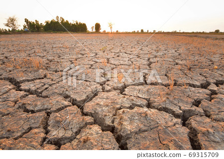 The fields are dry, the land is broken. And the evening sun. 69315709
