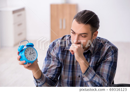 Young male watchmaker working in the workshop Young male watchmaker working in the workshop 69316123