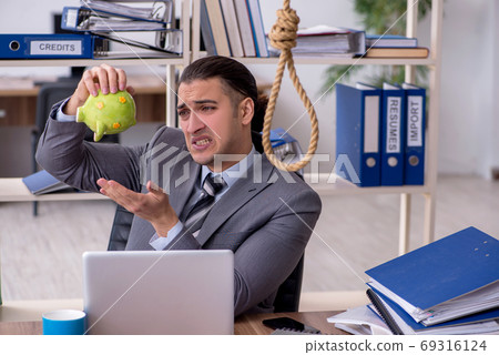 Young male employee committing suicide at workplace Young male employee committing suicide at workplace 69316124