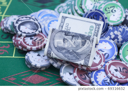 Poker chips,dollar notes,playing cards and dice Poker chips,dollar notes,playing cards and dice 69316632