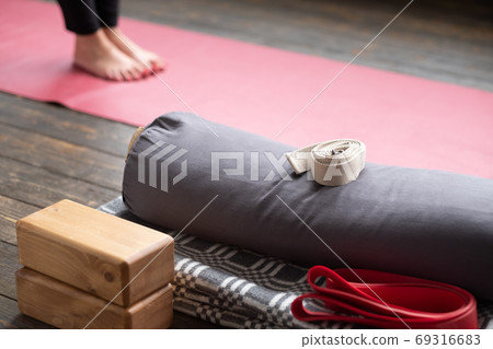 Caucasian females legs on yoga mat with yoga props 69316683