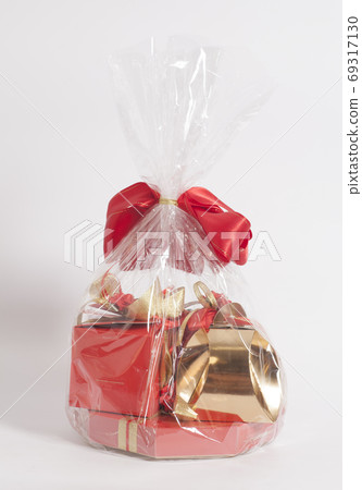 Gift Box with candies and red ribbon bow 69317130