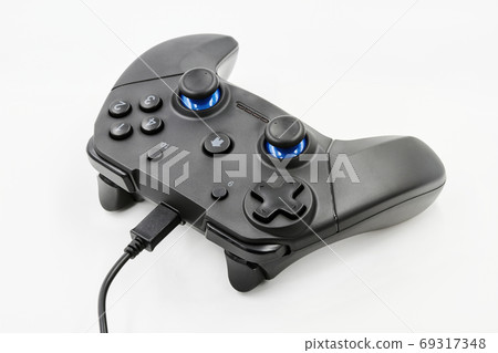 Gamepad with cable on a white background. Game 69317348