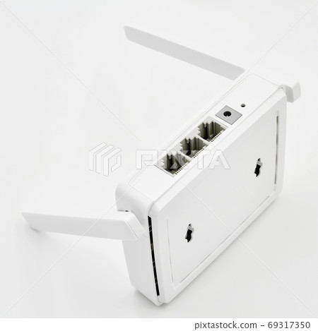 White wireless router on light background. 69317350