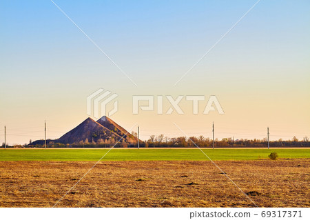 Ukrainian slagheap on a skyline. Spring, field, 69317371
