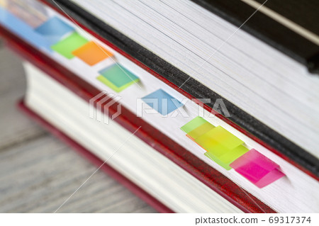Book with colorful bookmarks or memory notes Book with colorful bookmarks or memory notes 69317374