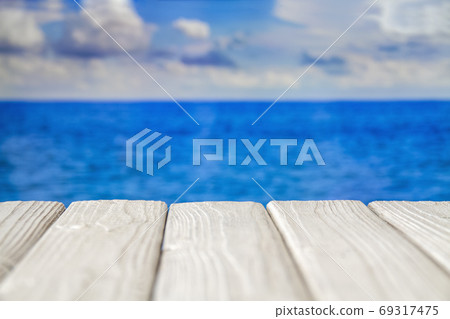 White empty wooden walkway at seacoast with cloudy White empty wooden walkway at seacoast with cloudy 69317475