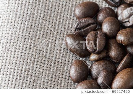 Close-up of coffee beans on linen fabric with copy Close-up of coffee beans on linen fabric with copy 69317490