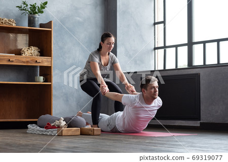Man practice with private teacher at home class, working out with instructor. Man practice with private teacher at home class, working out with instructor. 69319077
