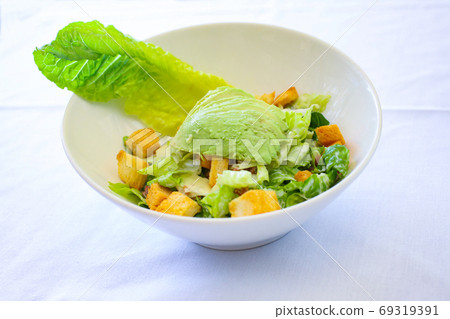 Caesar salad with avocado 69319391