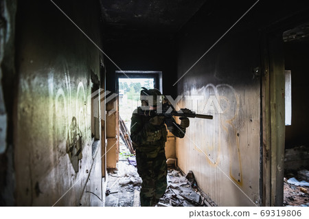 Soldier in combat. Urban combat training, soldier entering abandoned building. Anti terrorist operation battlefield training. Soldier in combat. Urban combat training, soldier entering abandoned building. Anti terrorist operation battlefield training. 69319806