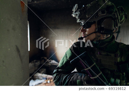 Soldier in combat. Urban combat training, soldier entering abandoned building. Anti terrorist operation battlefield training. Soldier in combat. Urban combat training, soldier entering abandoned building. Anti terrorist operation battlefield training. 69319812