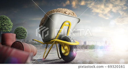 Wheelbarrow full of sand in city. Yellow wheelbarrow on single wheel Wheelbarrow full of sand in city. Yellow wheelbarrow on single wheel 69320161