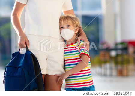 Mother and child with face mask and hand sanitizer Mother and child with face mask and hand sanitizer 69321047